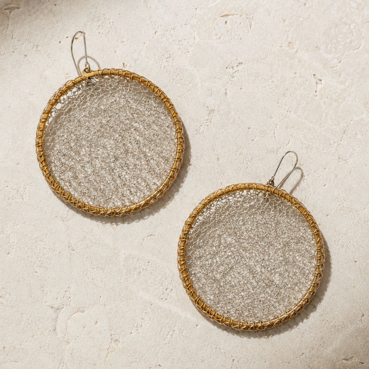 Crochet Eclipse hand-crocheted sterling silver earrings on brass hoops by JYOCO