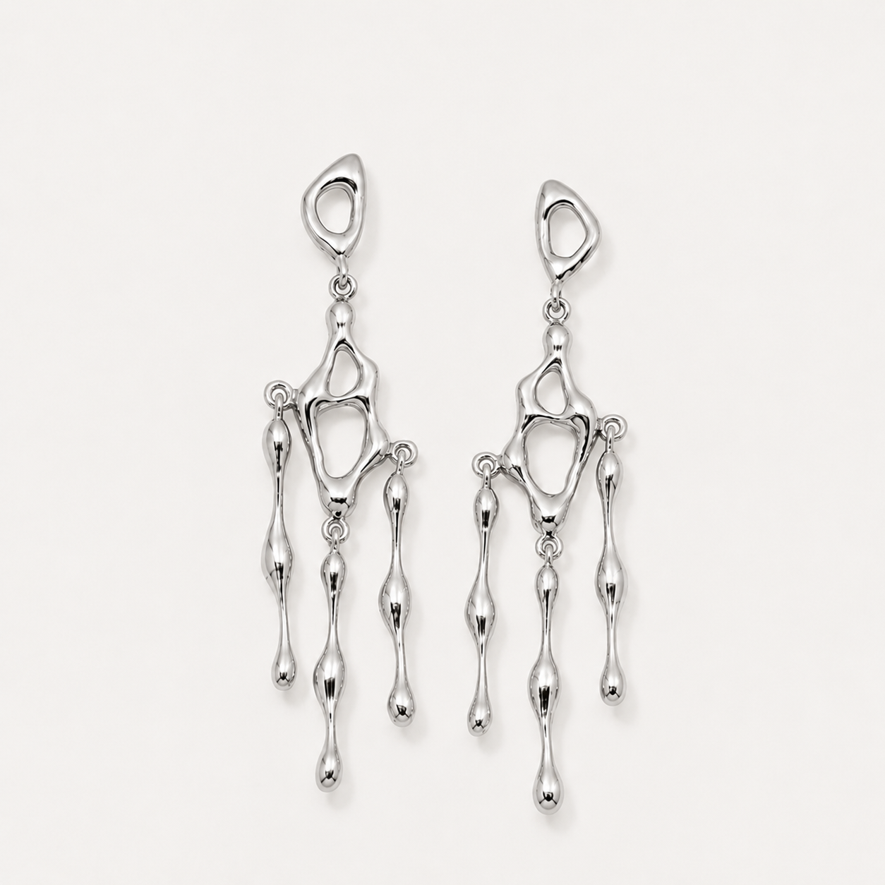 Pair of silver earrings on a light gray background