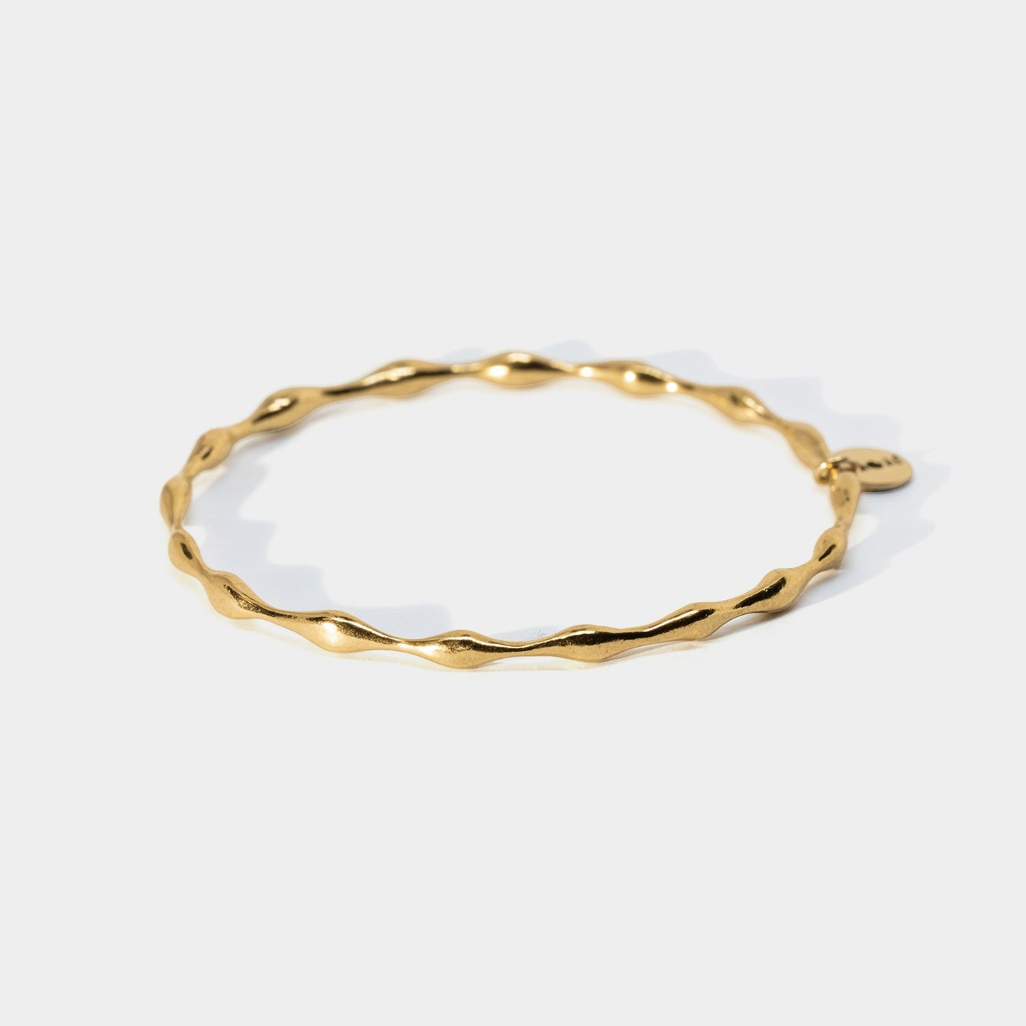 Gold bracelet on a white background