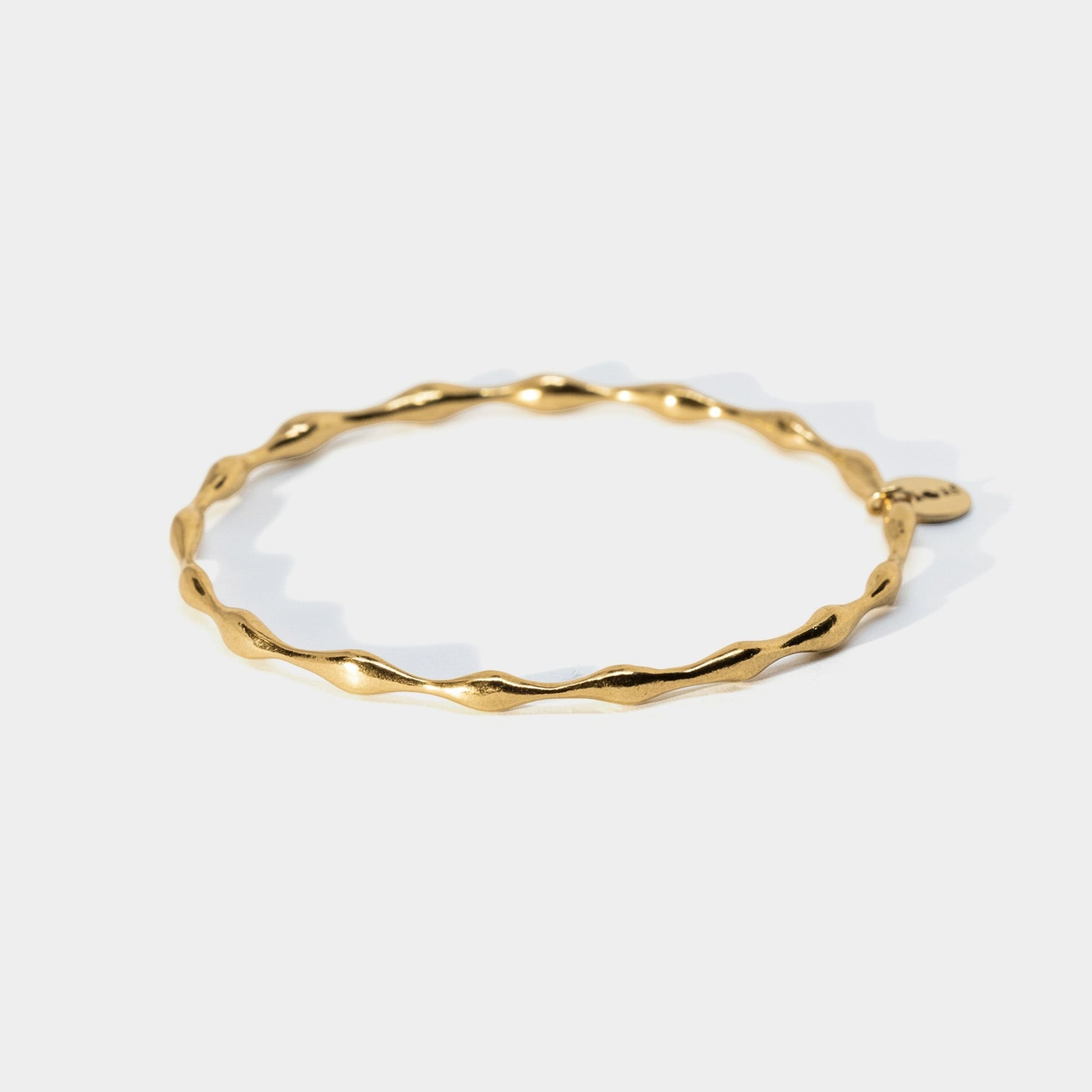 Gold bracelet on a white background